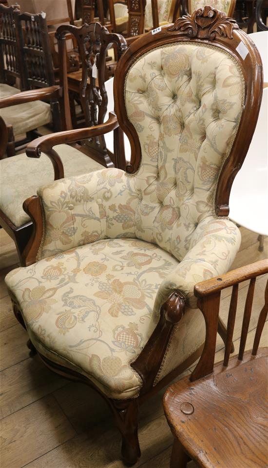 A Victorian walnut button back armchair